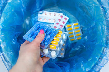 pills in waste container